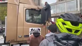 BLM protesters surround & hit a truck stuck on the road that has been shut down by them ChauvinTrial