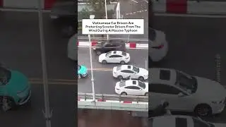 Vietnamese Car Drivers Are Protecting Scooter Drivers From The Wind During A Massive Typhoon