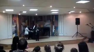 Сергей играет на кларнете