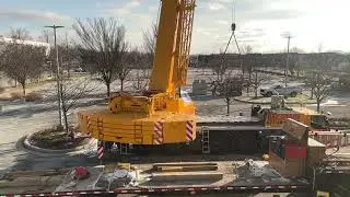 Crane moving the AC unit to 4th floor 