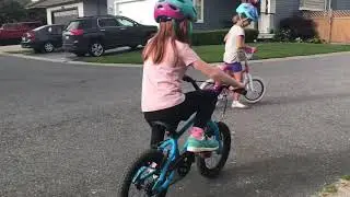 LEARNING TO RIDE HER BIKE