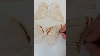 Artist is painting a butterfly in natural earth pigment watercolors!