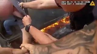 Cops Save Man from Burning Truck