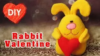 Funny yellow rabbit with heart. Gift for Valentine's Day.