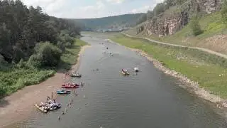People Boating And Kayaking On A River Valley