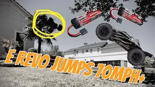 Traxxas E Revo jumps over 7 feet and crashes