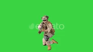 Soldier Firing From Lying Position on a Green Screen, Chroma Key | Stock Footage - Envato elements