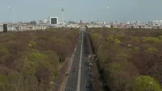 AERIAL: Strasse des 17. Juni with Pan up to reveal Brandenburg Gate in Berlin, Germany on Sunny Day