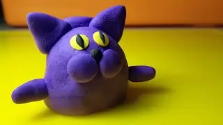 A cat or kitten made of clay. We sculpt a simple cat from air plasticine.