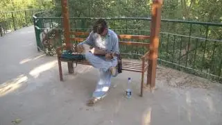 A guy playing Rabab in Lake View Park - Islamabad