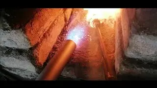 Gas burner for a forge with forced air supply.