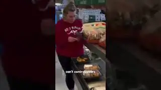 Woman takes a bite from a chicken