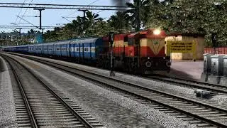 Express train hauled by ERS WDM3D departs Ernakulam Town
