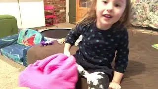 Little Girl playing with My Little Ponies