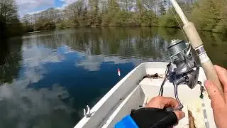 Man fishing Alone on a Lake