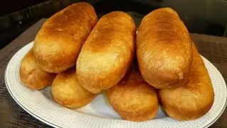 Sausages in dough fried in a frying pan