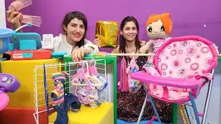 Ayşe ve Lili, Ümit'in mağazasından Ela oyuncak bebek için alışveriş yapıyor! Bebek bakma oyunları