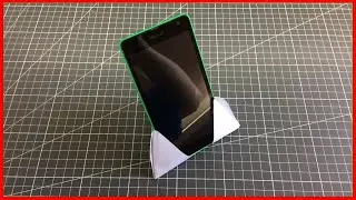 Phone stand made of A4 paper. Video diagram of how to make origami with your hands.