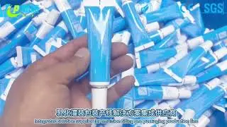 Automatic tube filling and sealing machine
