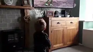 Little boy dancing in front of the TV | CONTENTbible