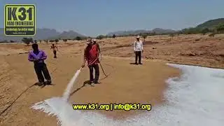 Customer trying to rip apart a piece of dried K31-APS polymer soil stabilizer