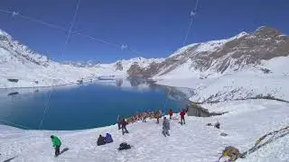 Aerial close up circular view group of trekkers by famous Tilicho lake trek viewpoint destination