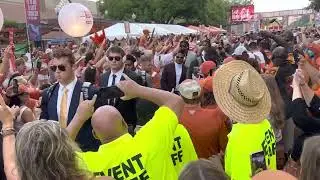The Texas Longhorn football team enters the stadium for the game via Alabama.