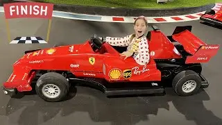 Sofia plays with her dad at the amusement park.