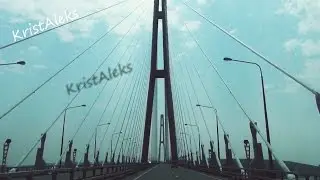 The bridge on the Russian Island. Go over the bridge to the Island Russian. Ride around the island.