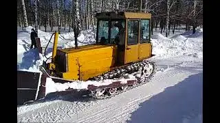 Old soviet dozer tractor pushin' snow