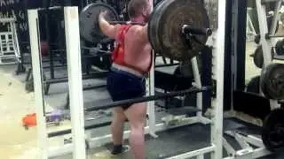 Mr. Bill squatting 405 for 8 reps raw.