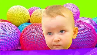 Yarik Plays with Giant Balls and Rides a Tubing on the Indoor Playground