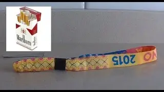 Removing festival bracelet with a pack of cigarettes