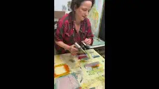 Working on a larger encaustic paintings