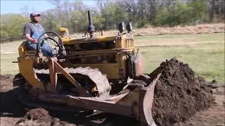 fixing the road with a D2 Caterpillar and pull grader.