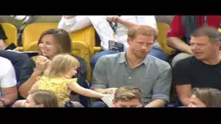 Sneaky toddler steals Prince Harry s popcorn