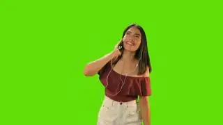 Mixkit-girl-dancing-with-her-earphones-on-a-green-background video