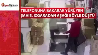 Telefonuna bakarak yürüyen şahıs, ızgaradan aşağı böyle düştü