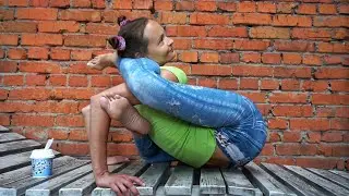 Contortion yoga poses. Flexshow. Legs behind head training. Flexible yoga girl Natalya.