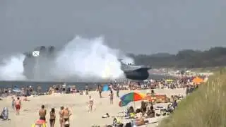 Navy Hovercraft Lands On Busy Beach