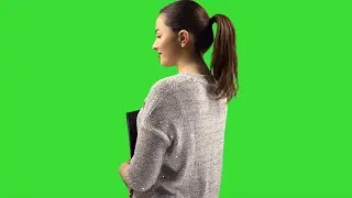 woman posing with a green screen background