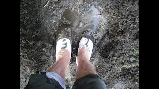 White plmsolls with blue and white striped elastic get muddy