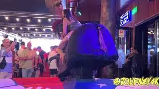 Two Pretty Girls Riding on a Mechanical Bull in Benidorm    Bull Riding 4K
