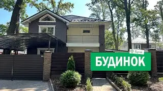 Двоповерховий будинок в Бучі, з терасою і навісом для авто