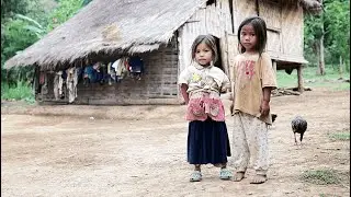 A Thai village in the middle of the jungle, the kind journalists won't show you. A Thai man invit...