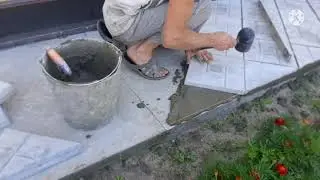 Laying paving slabs on a concrete base, experiment