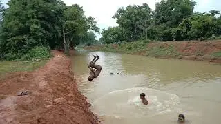Indian boys  take bath in Dam Cannel in West Bengal