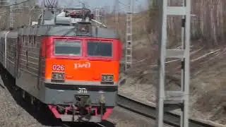 Trains pass by, heavy wheel clatter.