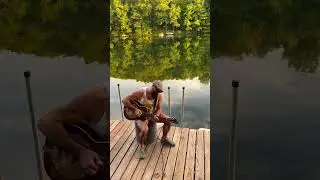 Zen moment with the slide and a national guitar on the dock.