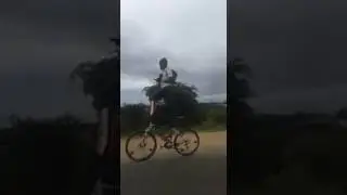 This video made my day  he is standing on the moving bicycle.